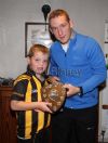 John V Morgan receives the North Antrim Under 10 League Shield from Richie Hogan